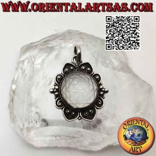 silver pendant with mandalas engraved on rock crystal