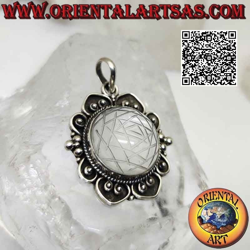 Silver pendant with Sri Yantra mandala engraved on round cabochon rock crystal on baroque setting