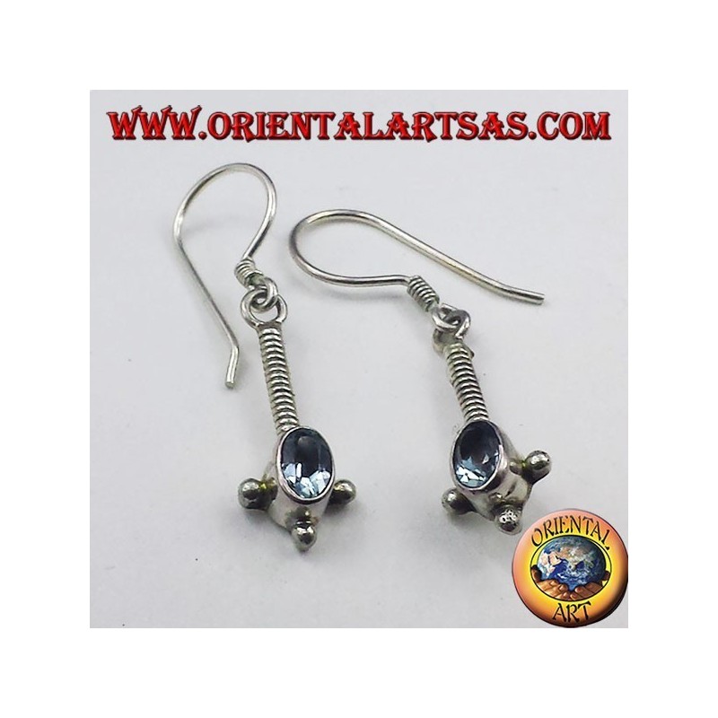 Silver earrings with oval faceted blue topaz