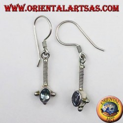 Silver earrings with oval faceted blue topaz
