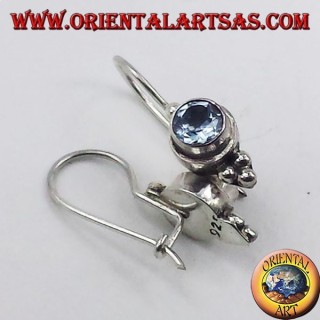 Silver earrings with blue topaz faceted round