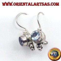 Silver earrings with blue topaz faceted round