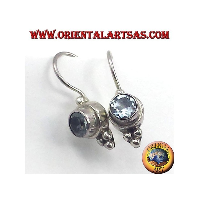 Silver earrings with blue topaz faceted round