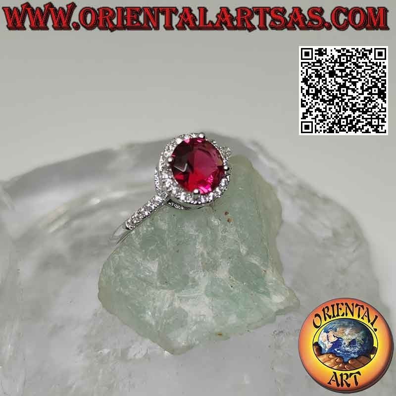 Bague en argent avec rubis synthétique rond serti entouré de zircons et extension sur les côtés