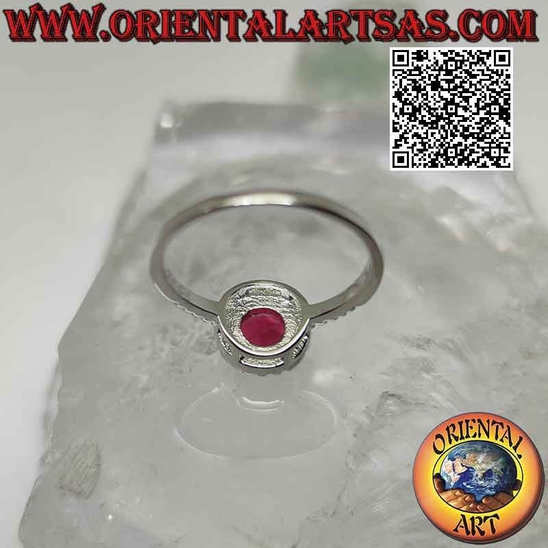 Silver ring with round synthetic ruby set surrounded by zircons and extension on the sides