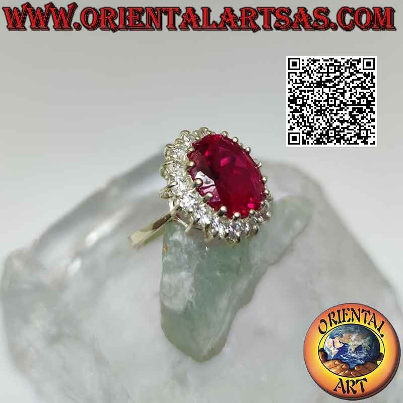 Anillo de plata con gran rubí sintético ovalado engastado rodeado de circonitas blancas redondas
