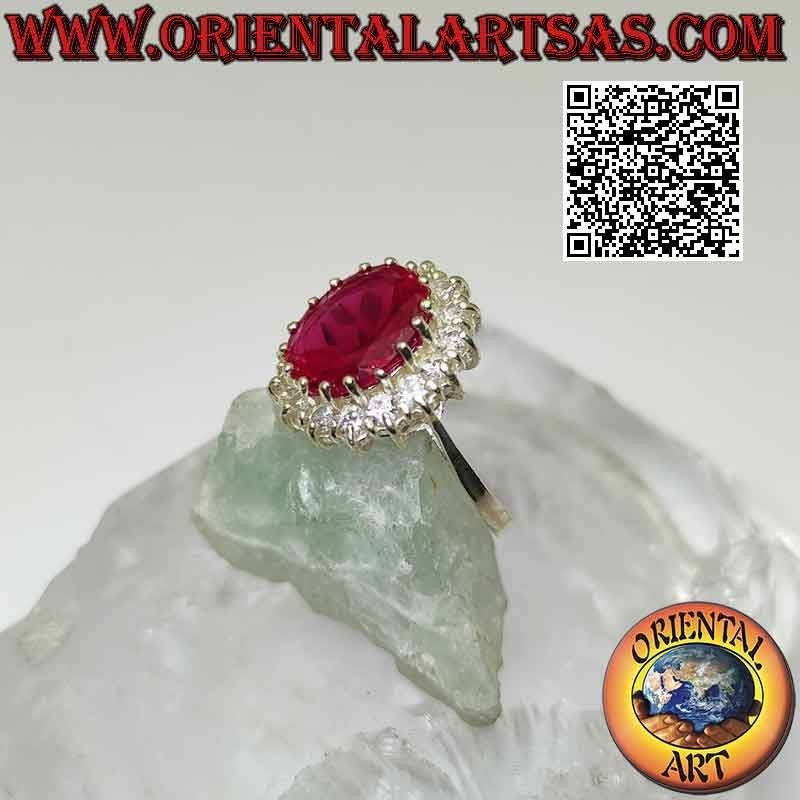 Anillo de plata con gran rubí sintético ovalado engastado rodeado de circonitas blancas redondas