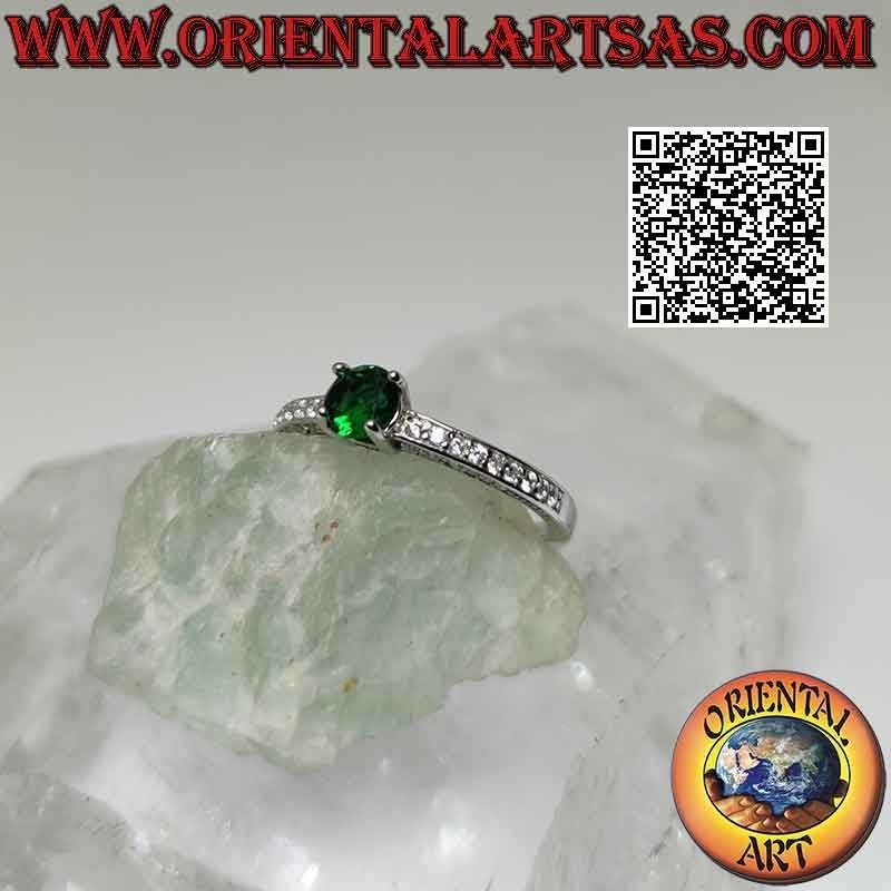 Solitaire silver ring with round synthetic emerald set and white zircons on the sides