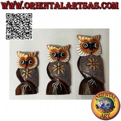 Owl sculpture with daisy,...