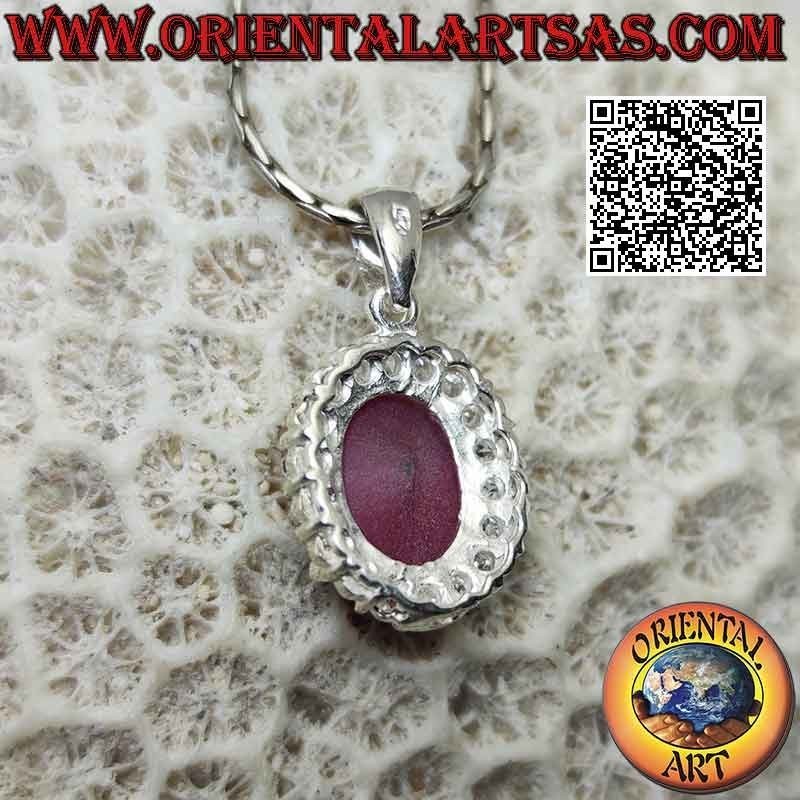 Silver pendant with large oval synthetic ruby set surrounded by set round zircons