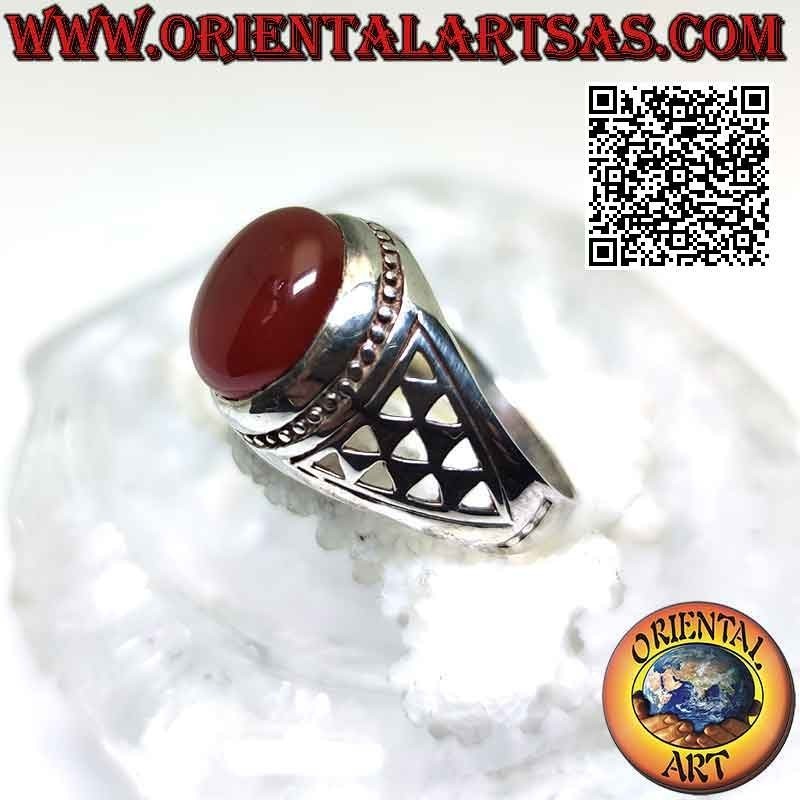 Silver ring with round cabochon carnelian and a series of triangular openwork on the sides
