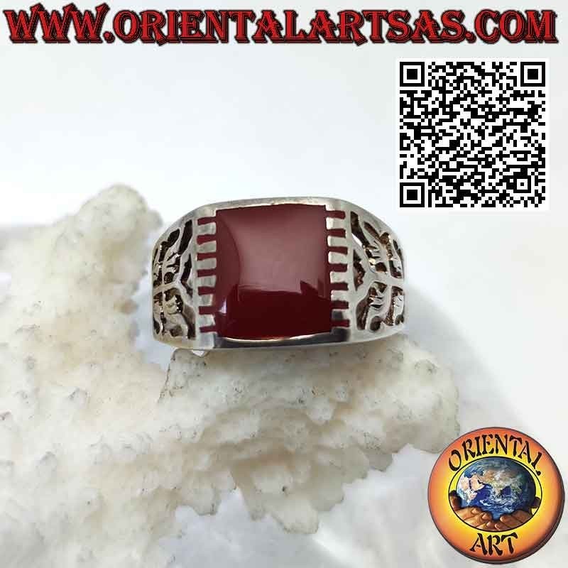 Silver ring with rectangular carnelian hooked laterally and curved motif on a perforated background