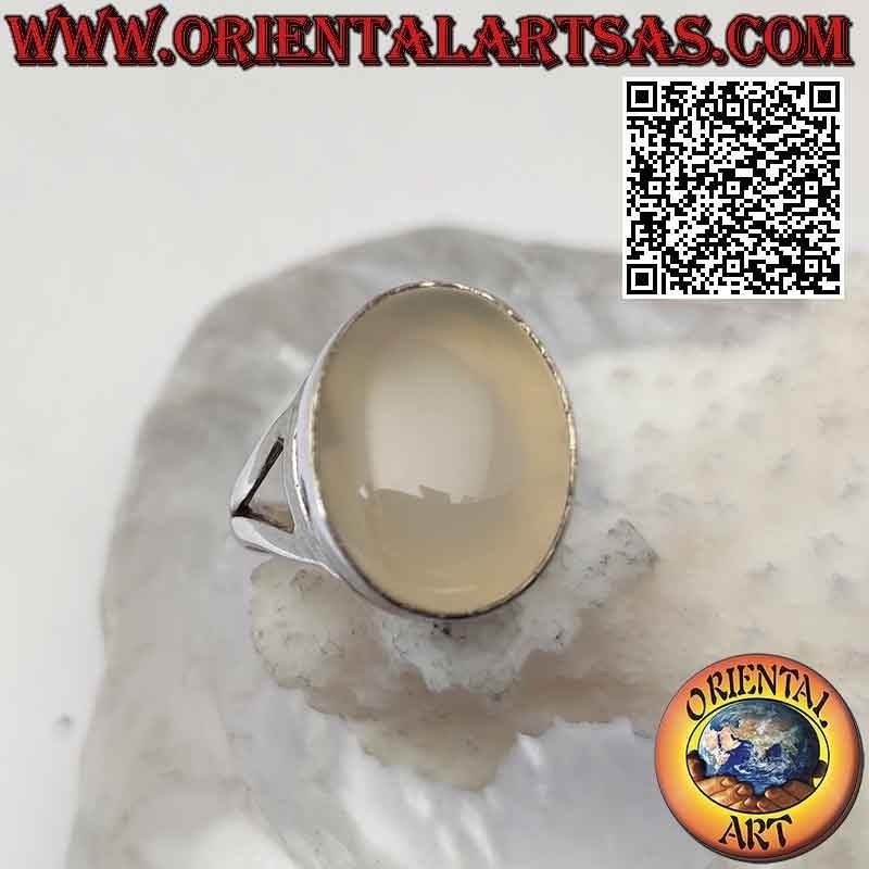 Silver ring with oval cabochon moonstone on a smooth setting of sinuous lines