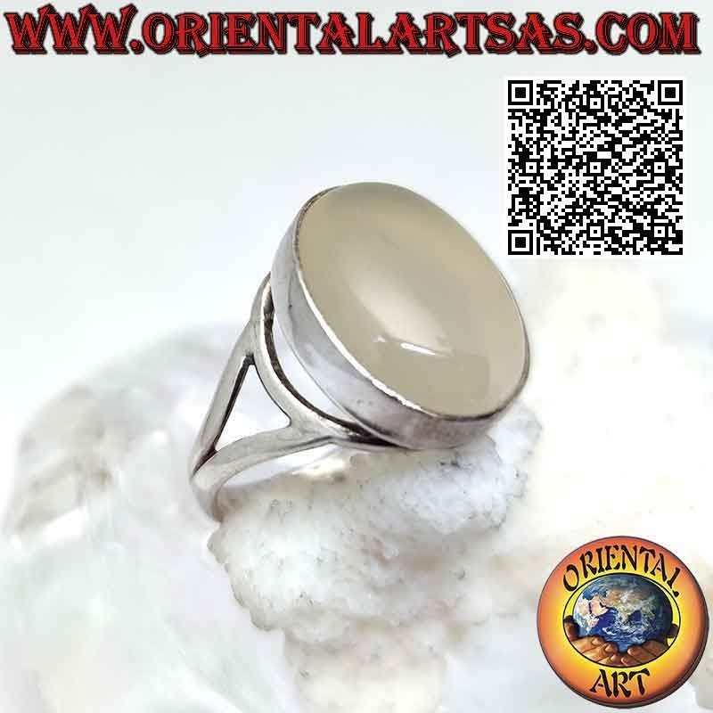 Silver ring with oval cabochon moonstone on a smooth setting of sinuous lines