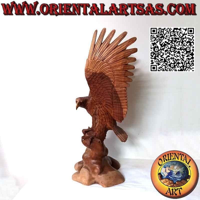 Golden eagle sculpture with spread wings standing on the 80 cm suar wood promontory
