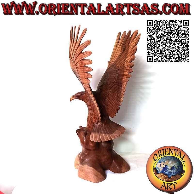 Golden eagle sculpture with spread wings standing on the 80 cm suar wood promontory