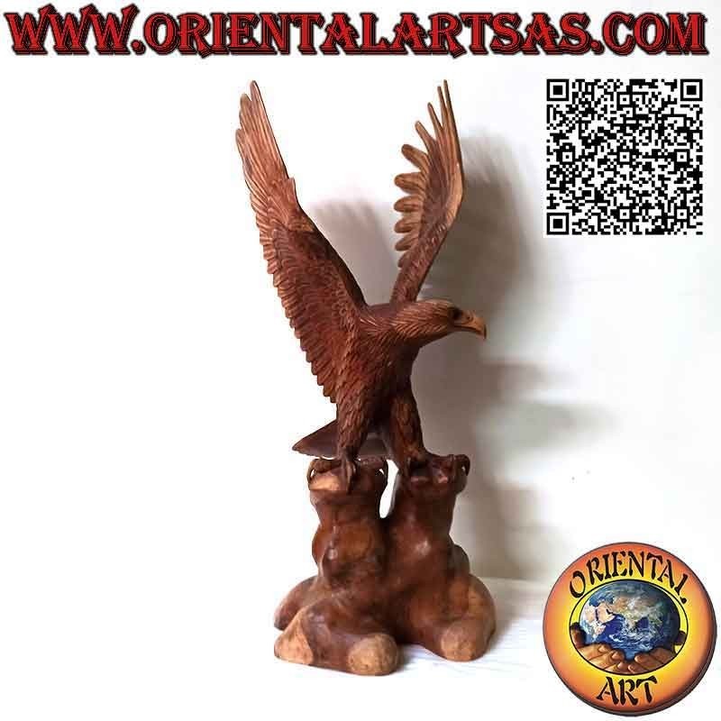 Golden eagle sculpture with spread wings standing on the 80 cm suar wood promontory