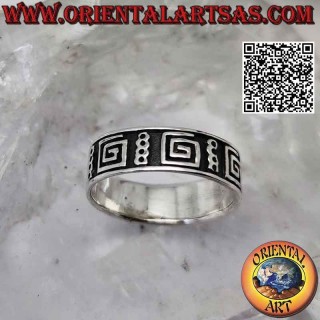 Silver band ring worked with a series of smooth squared spirals in bas-relief