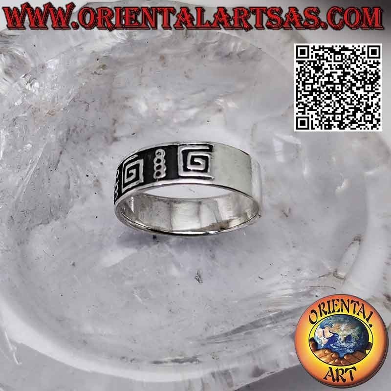 Silver band ring worked with a series of smooth squared spirals in bas-relief
