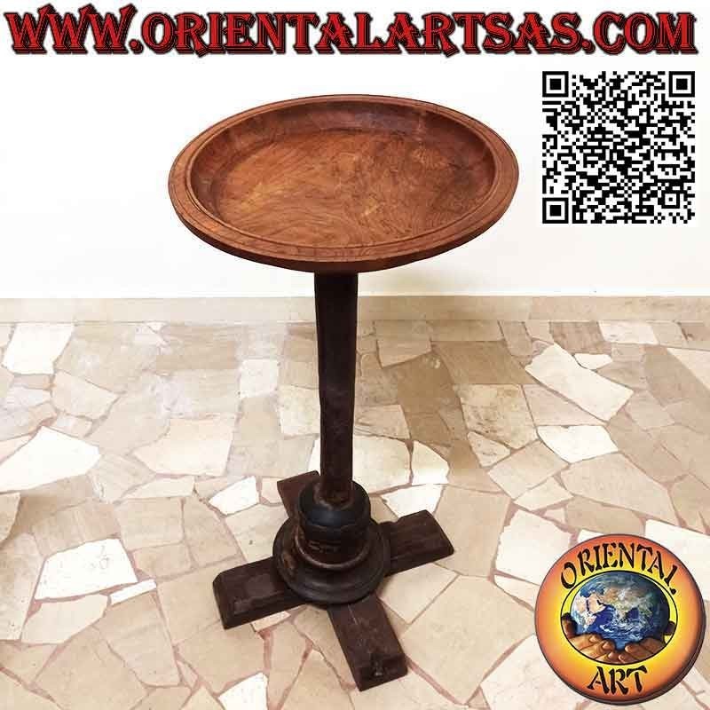 Round coffee table with decentralized top on curved axis in antique teak wood
