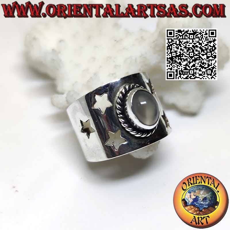 Silver band ring with oval cabochon moonstone and pierced stars