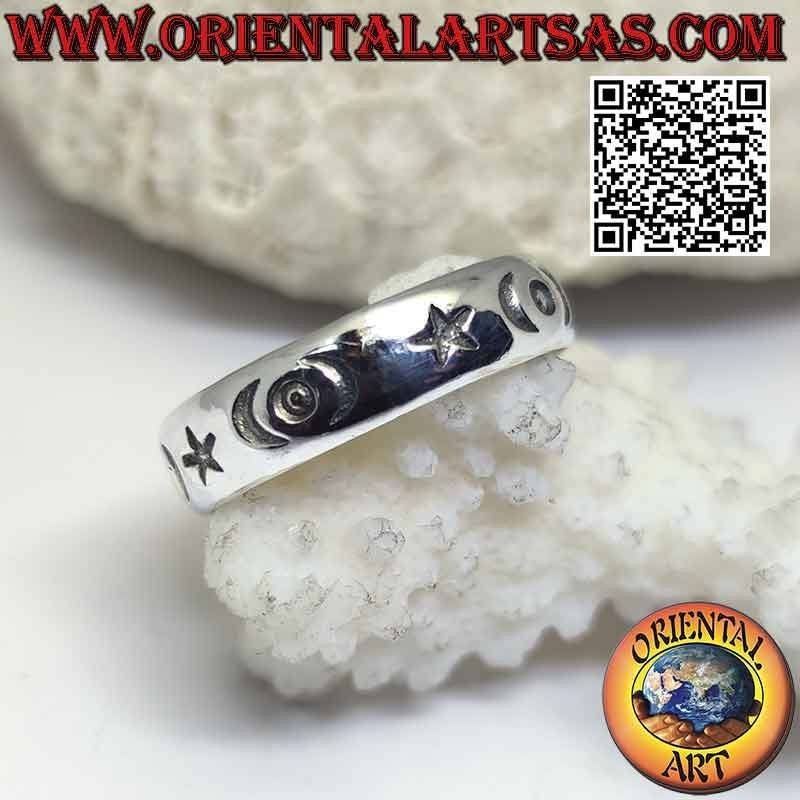 Silver band ring with stars, crescents and engraved circles