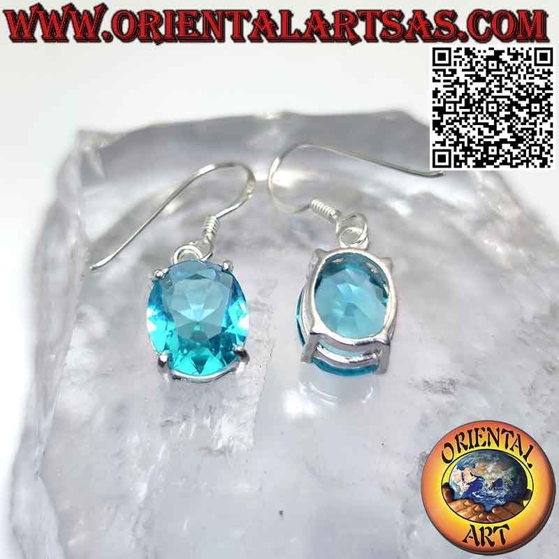 Silver earrings with oval faceted topaz set in a smooth double frame