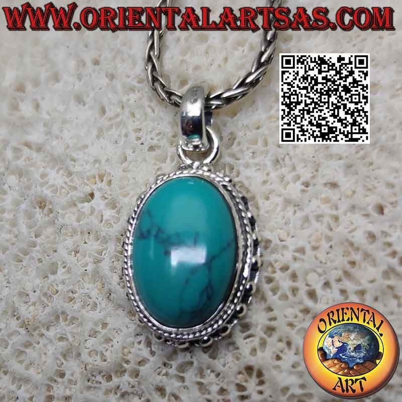 Silver pendant with oval cabochon turquoise surrounded by intertwining and smooth studded balls