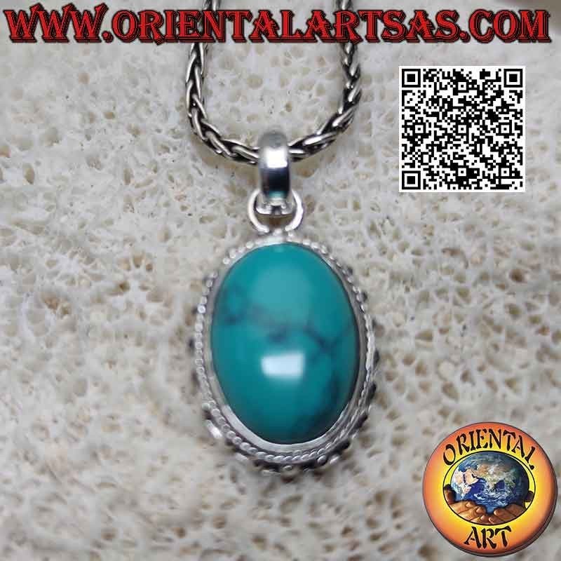 Pendentif en argent avec cabochon ovale turquoise entouré de boules cloutées entrelacées et lisses
