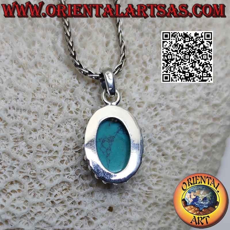 Silver pendant with oval cabochon turquoise surrounded by intertwining and smooth studded balls