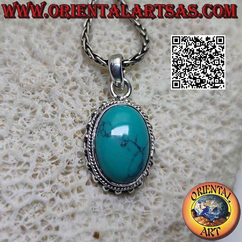 Silver pendant with oval cabochon turquoise surrounded by intertwining and smooth studded balls