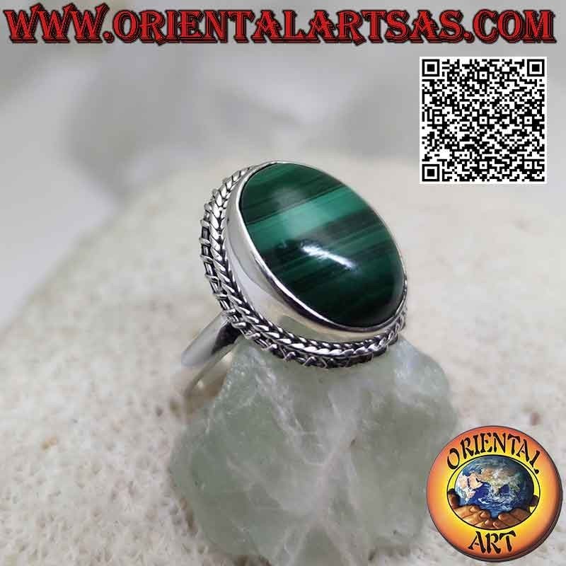 Silver ring with cabochon oval malachite (horizontal streaks) surrounded by interweaving and helical line