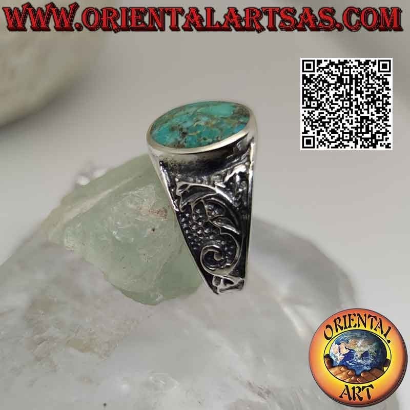 Anillo de plata con turquesa natural de Arizona ovalada y decoración floral en los laterales
