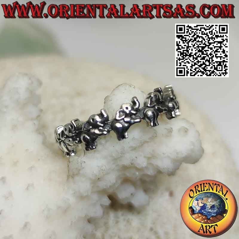 Silver band ring with rampant elephants with trunk up in a row