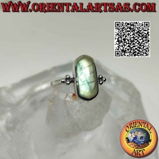 Silver ring with elongated hexagonal labradorite on smooth setting with trio of balls on the sides