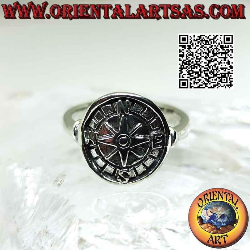 Silver ring with compass rose in bas-relief on a round medal