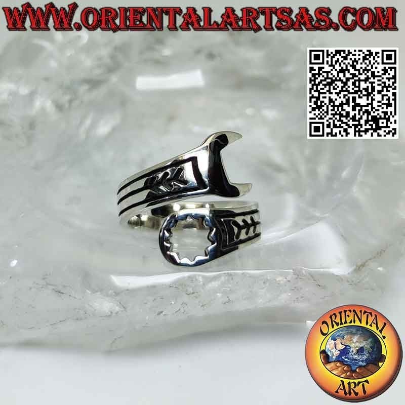 Smooth silver ring in the shape of a wrench with engravings