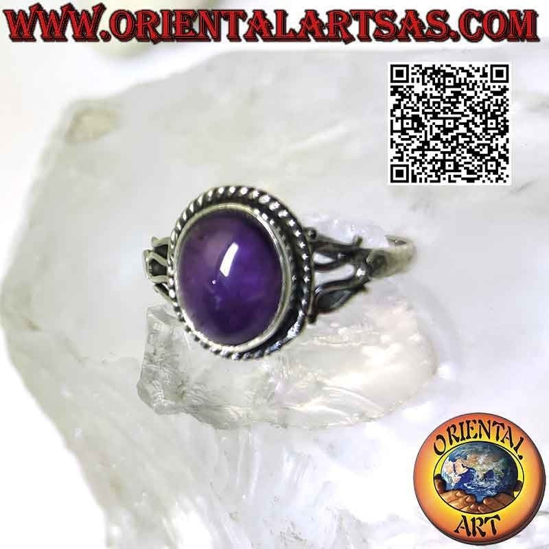 Silver ring with oval cabochon amethyst and serpentine on the sides