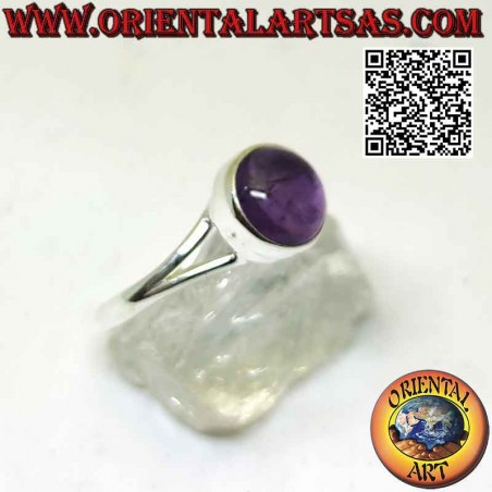 Silver ring with round cabochon amethyst on a smooth frame attached to two