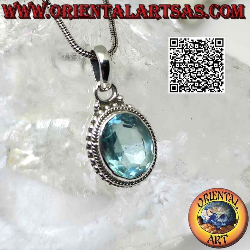 Silver pendant with oval blue topaz and intertwining and balls