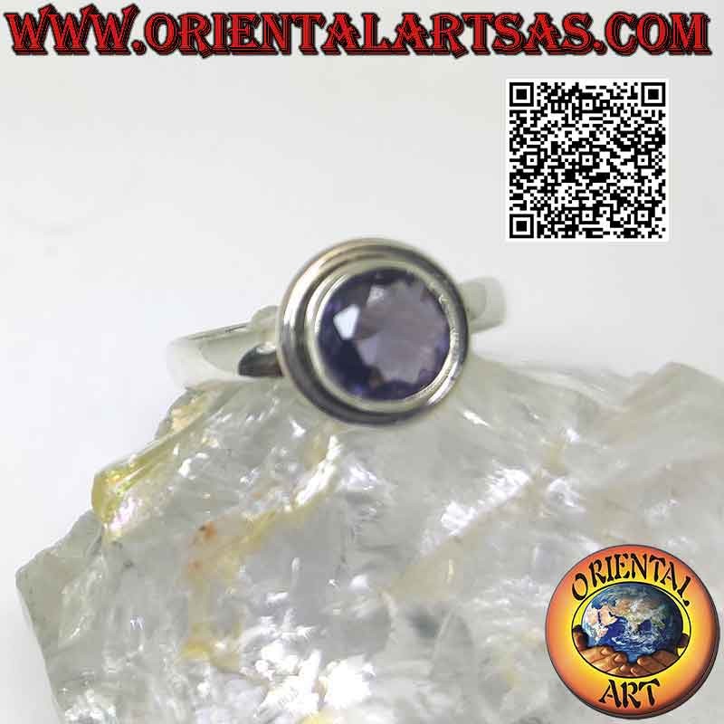 Silver ring with raised faceted round amethyst with protruding smooth edge