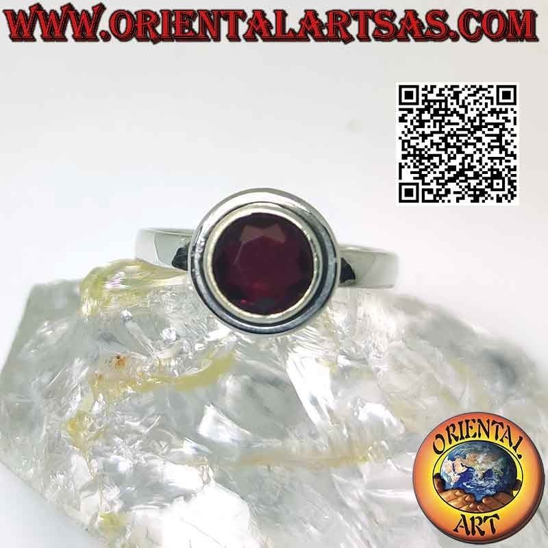 Silver ring with raised faceted round garnet