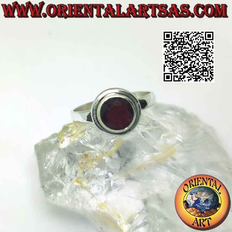 Silver ring with raised faceted round garnet
