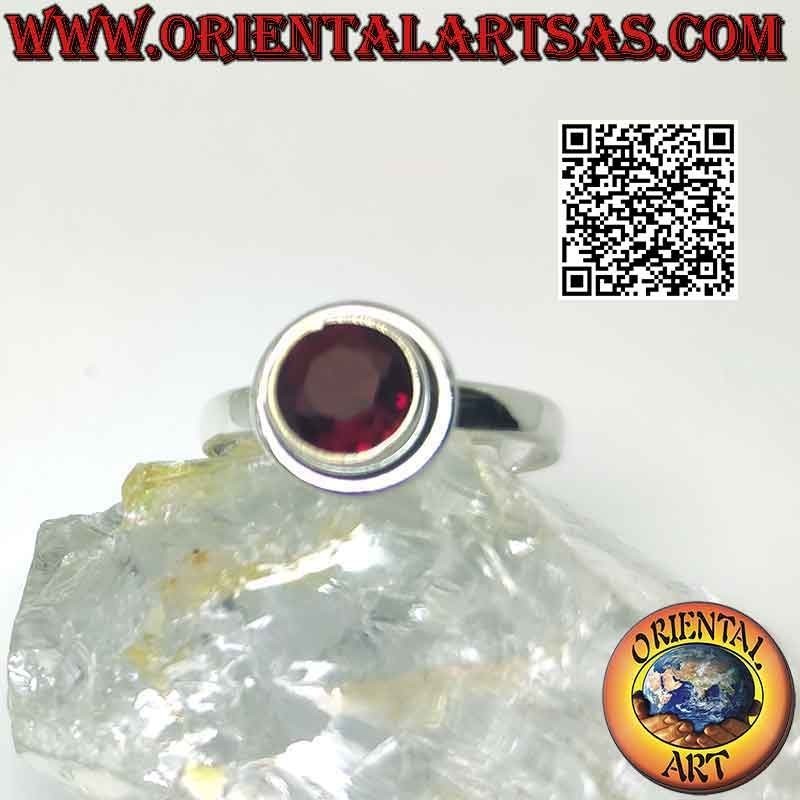 Silver ring with raised faceted round garnet