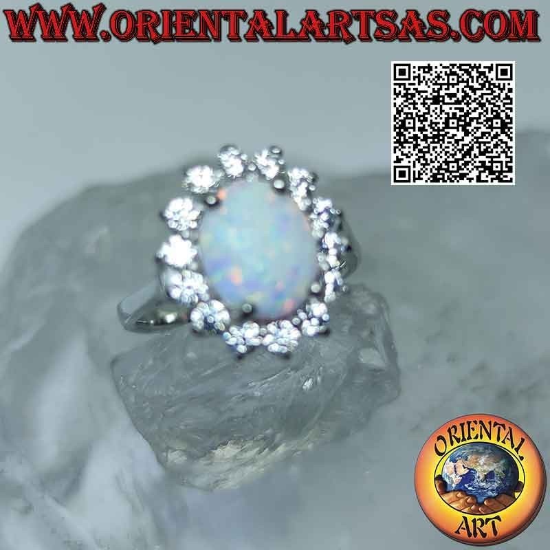 Silver ring with oval harlequin opal surrounded by zircons