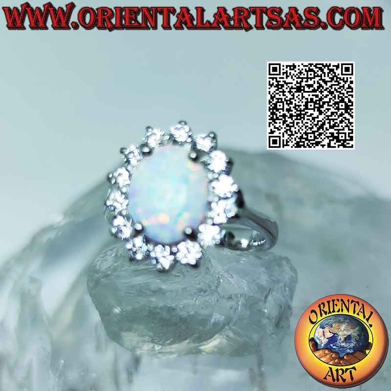 Silver ring with oval harlequin opal surrounded by zircons