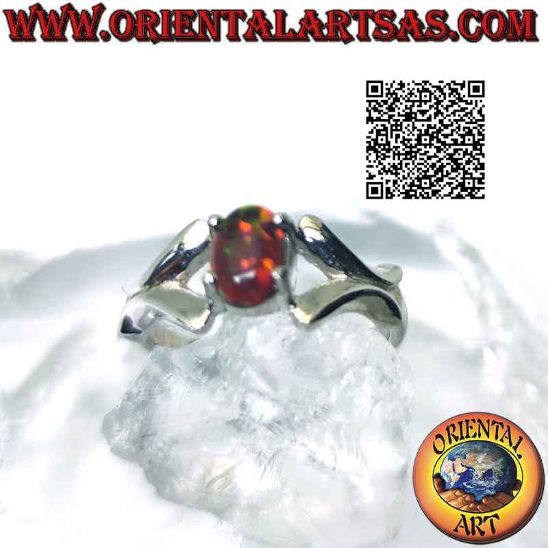 Silver ring with oval cabochon fire opal set hooked by smooth X on the sides