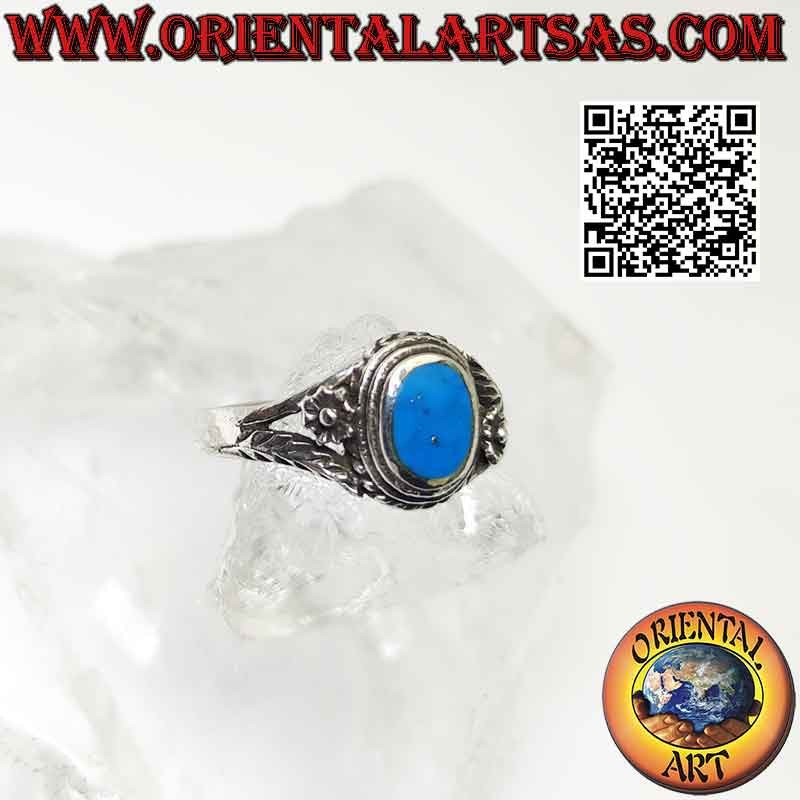 Bague en argent avec turquoise ovale et fleur et branche asymétriques sur les côtés