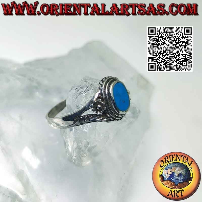 Silver ring with oval turquoise and asymmetrical flower and branch