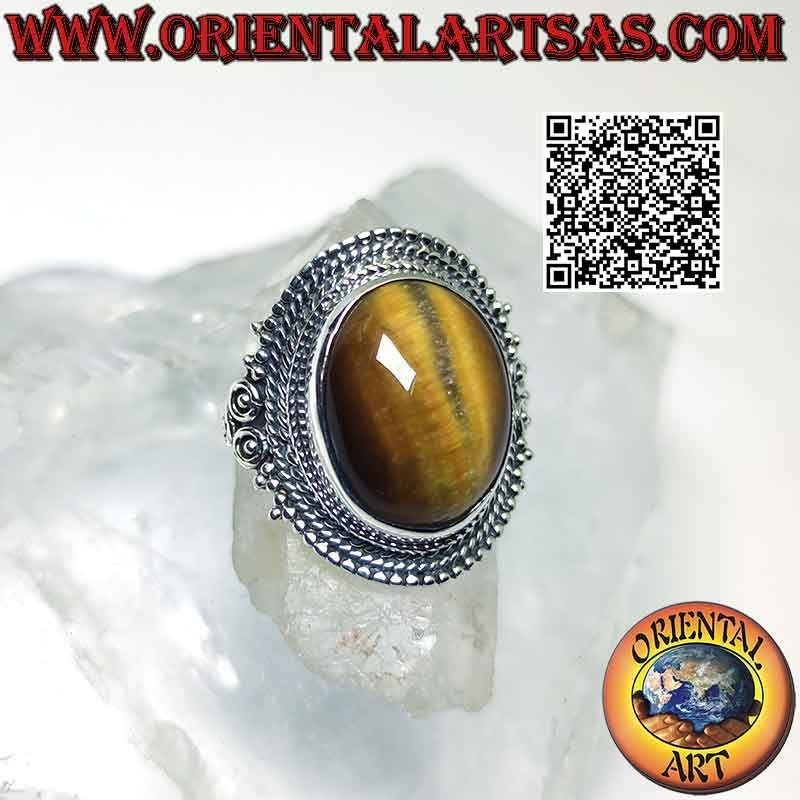 Anillo de plata con gran ojo de tigre y decoración de microesferas.